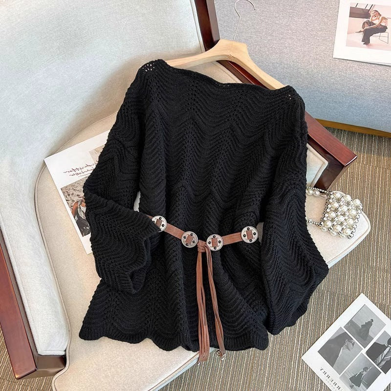 Women’s black one-shoulder knit pullover sweater with textured stitch and tassel drawstring