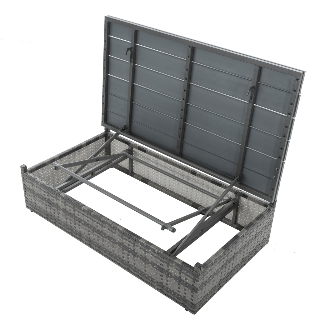 Outdoor wicker storage bench with open frame and gray interior