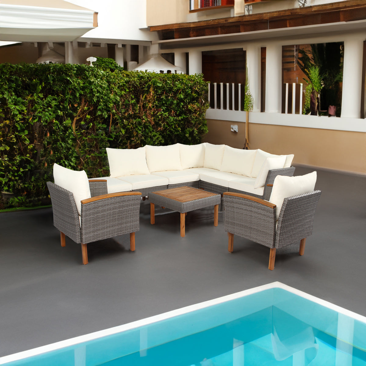 Outdoor rattan patio sectional with beige cushions and dark wicker coffee table