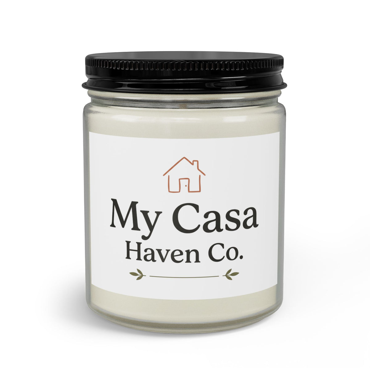 Clear jar candle with black lid, pale cream wax, printed house logo and decorative base
