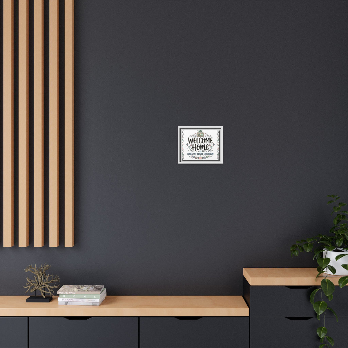 Framed matte canvas “Welcome Home” with dark frame centered on wall