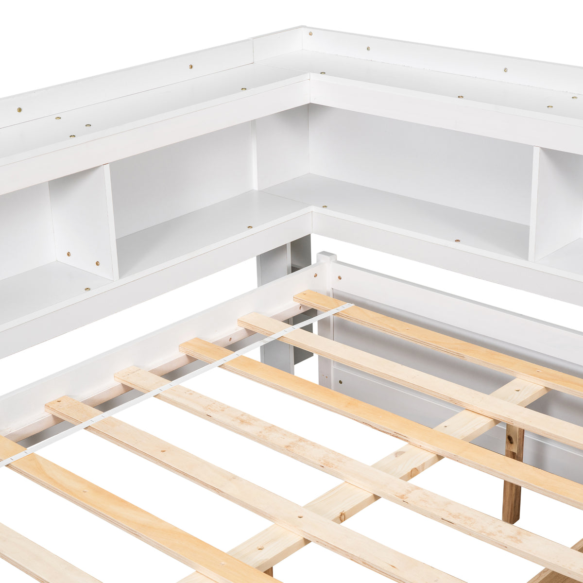White bed frame interior with L-shaped bookcase compartments and wooden slats