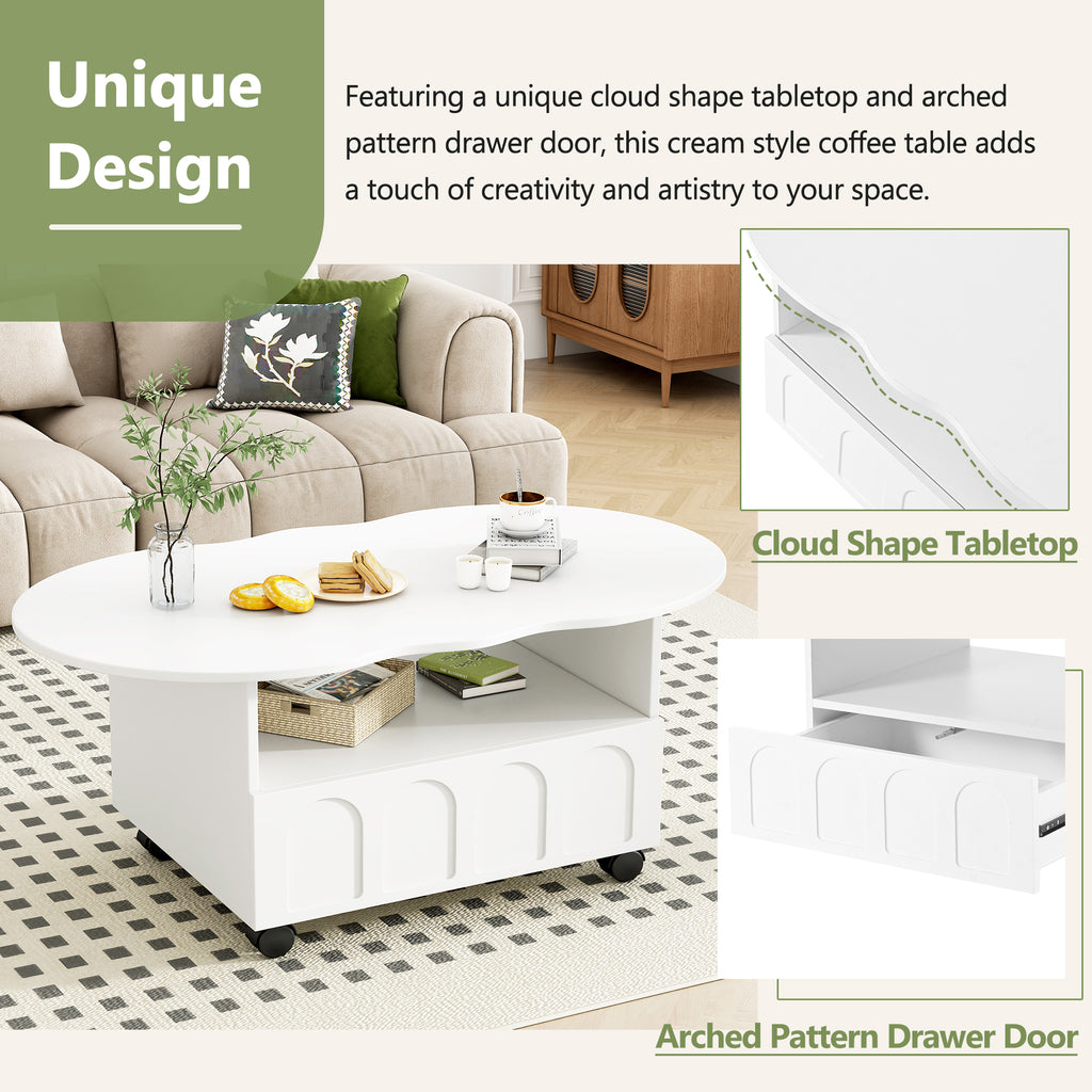 White oval coffee table with cloud-shaped tabletop and arched drawer door, on casters