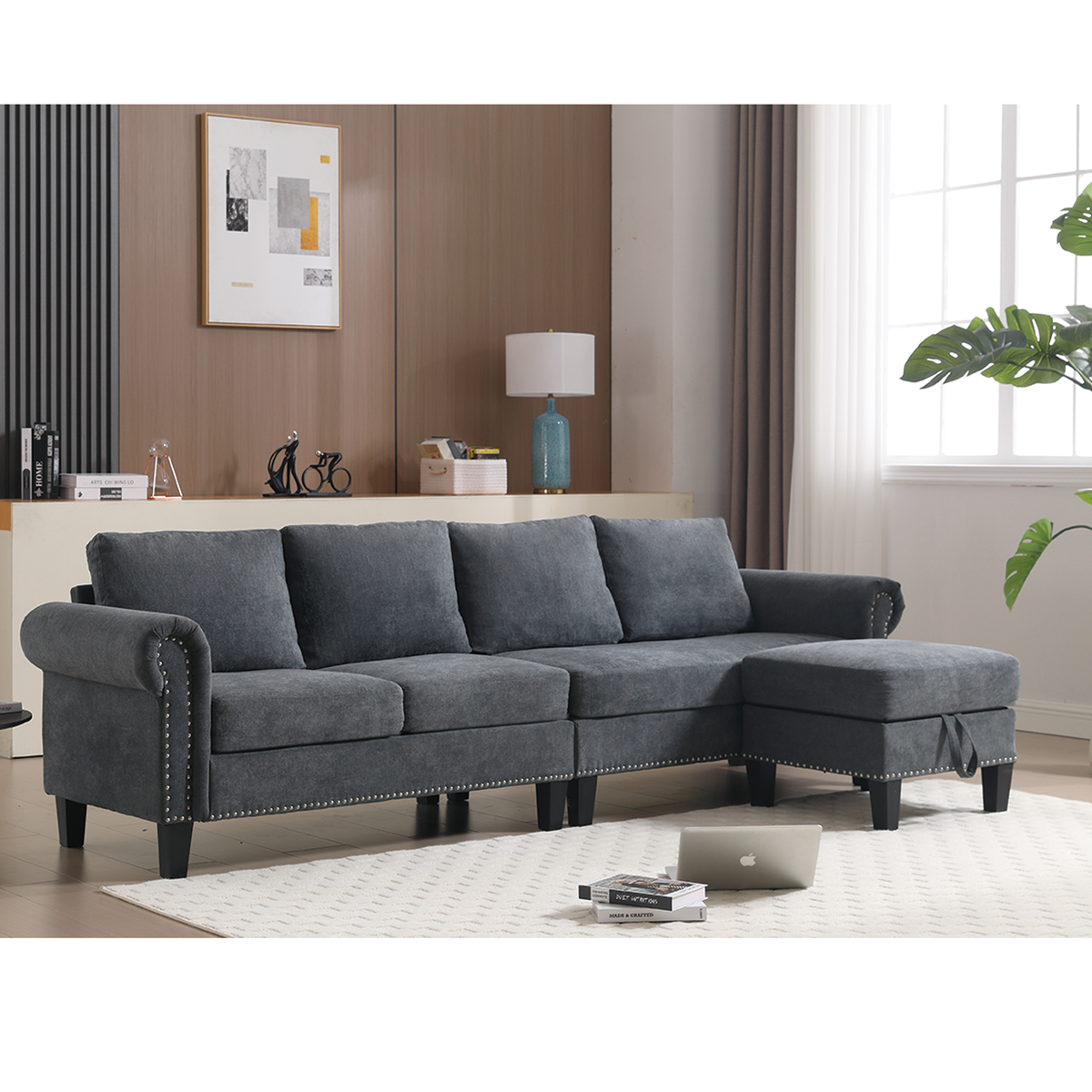 Gray L-shaped sectional sofa with tufted side accents and chaise ottoman
