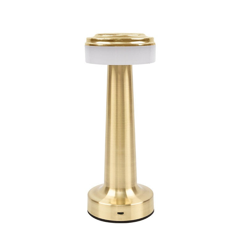 Gold retro table lamp with frosted top cover over LED and metal base
