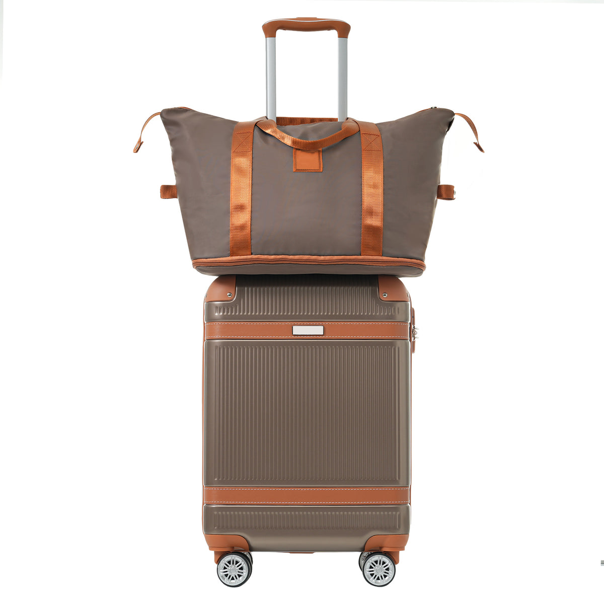 Coppery carry-on suitcase topped with a gray duffel bag and brown carrying handles
