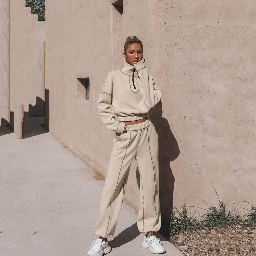 Beige zip-up sports hoodie and matching jogger pants set, full-body view