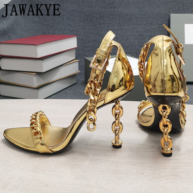Gold metallic high-heel sandals featuring chain accents and open toe ankle strap