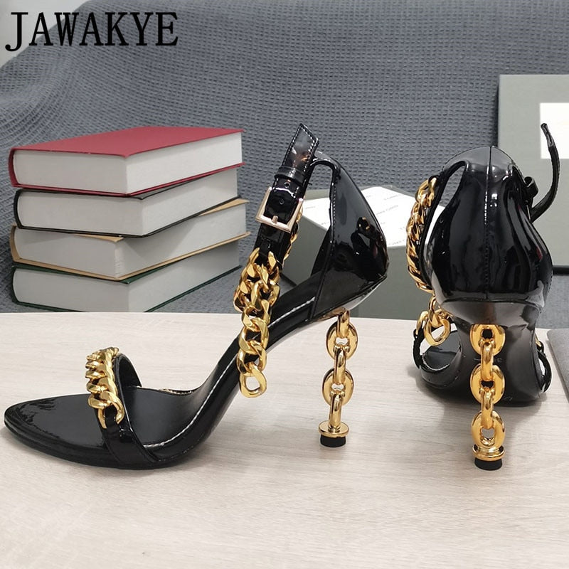 Black high-heel sandal with gold chain shoulder-style strap and ankle buckle