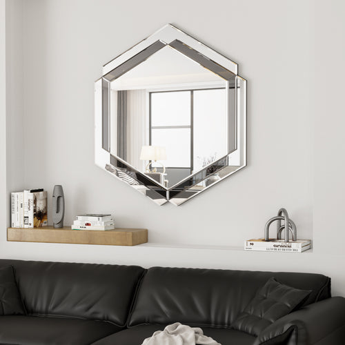 Silver beveled wall mirror with octagon frame, mounted above a dark sofa