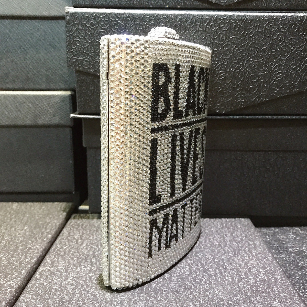Silver rhinestone mini dinner bag, side view with “BLACK LIVES MATTER” lettering