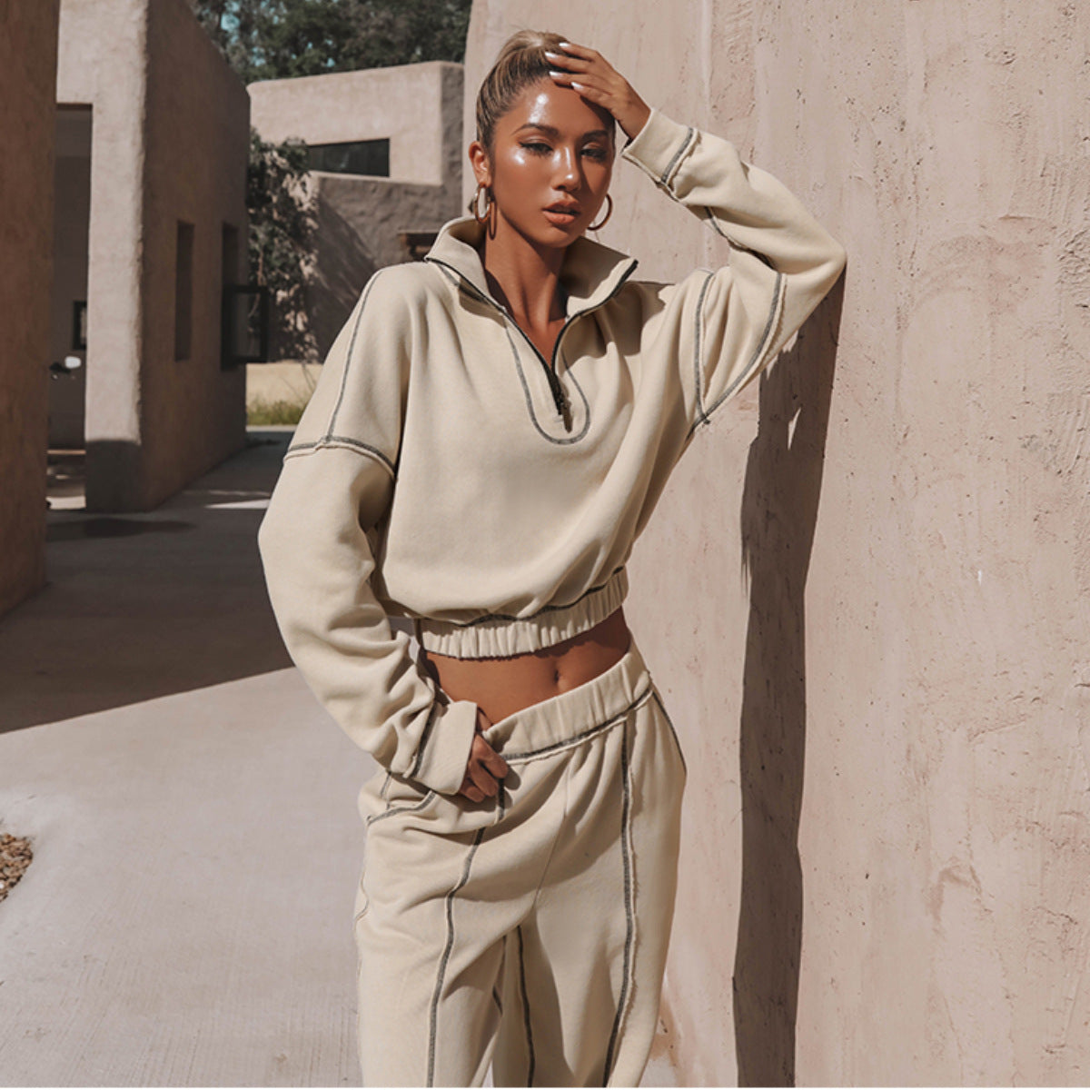 Beige cropped sports hoodie and jogger set with half-zip, elastic cuffs, drawcord waist