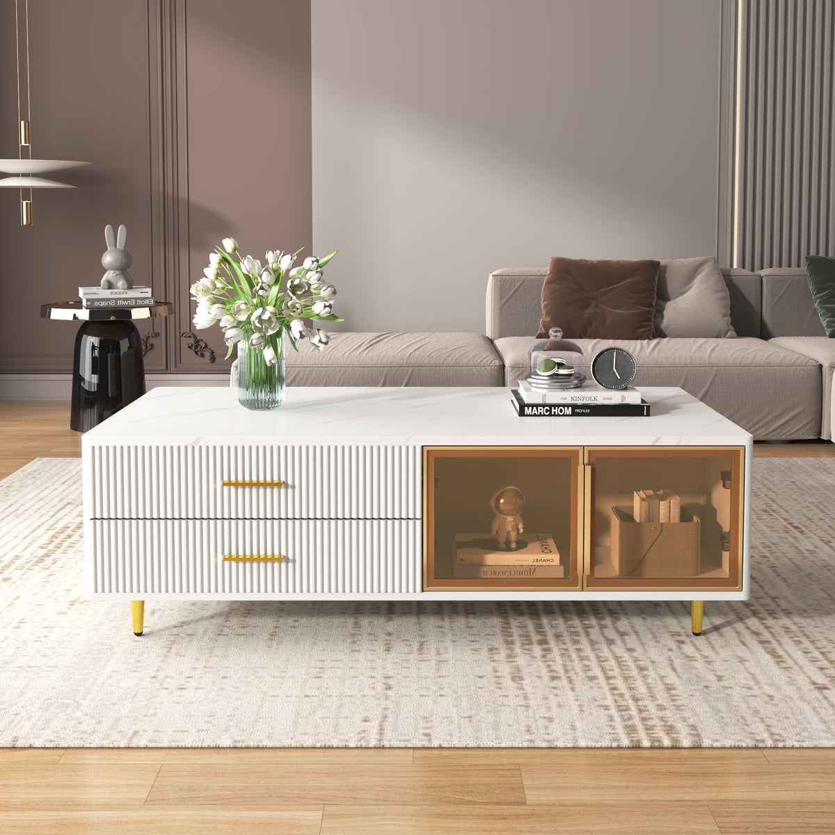 White coffee table with two glass doors, ribbed sides, gold legs, drawer fronts