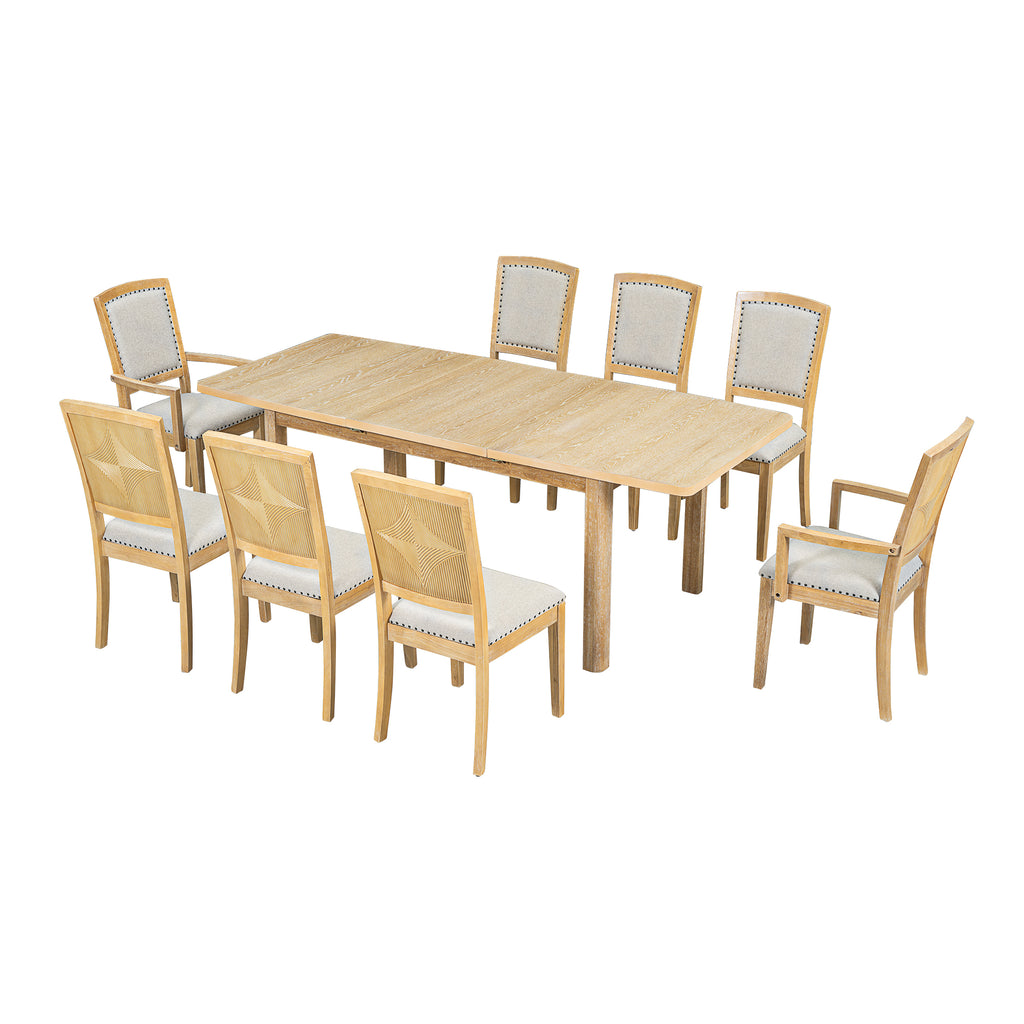 Expandable dining table with natural wood finish and eight upholstered chairs