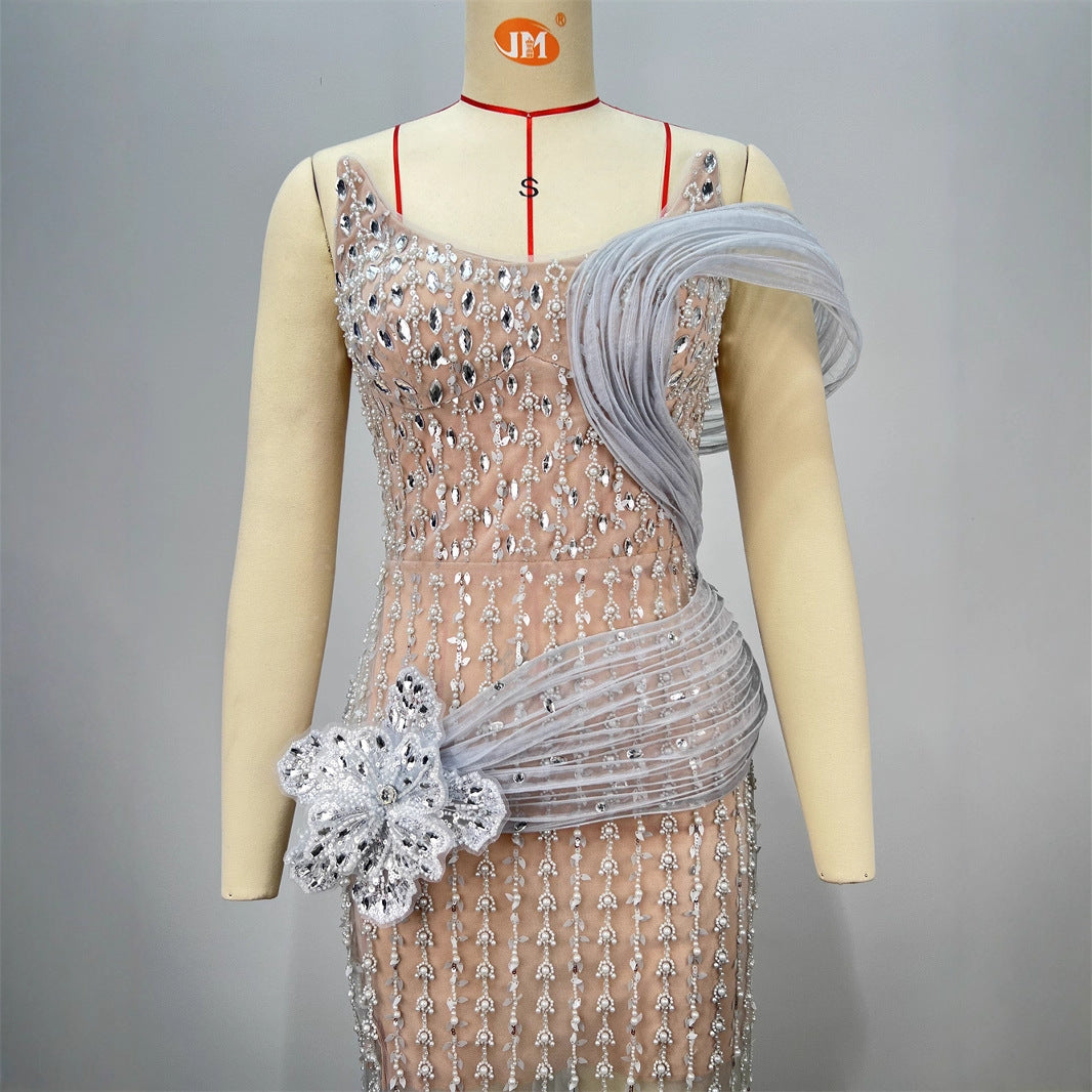 Silver sequined one-shoulder strapless evening dress with tulle wrap and flower