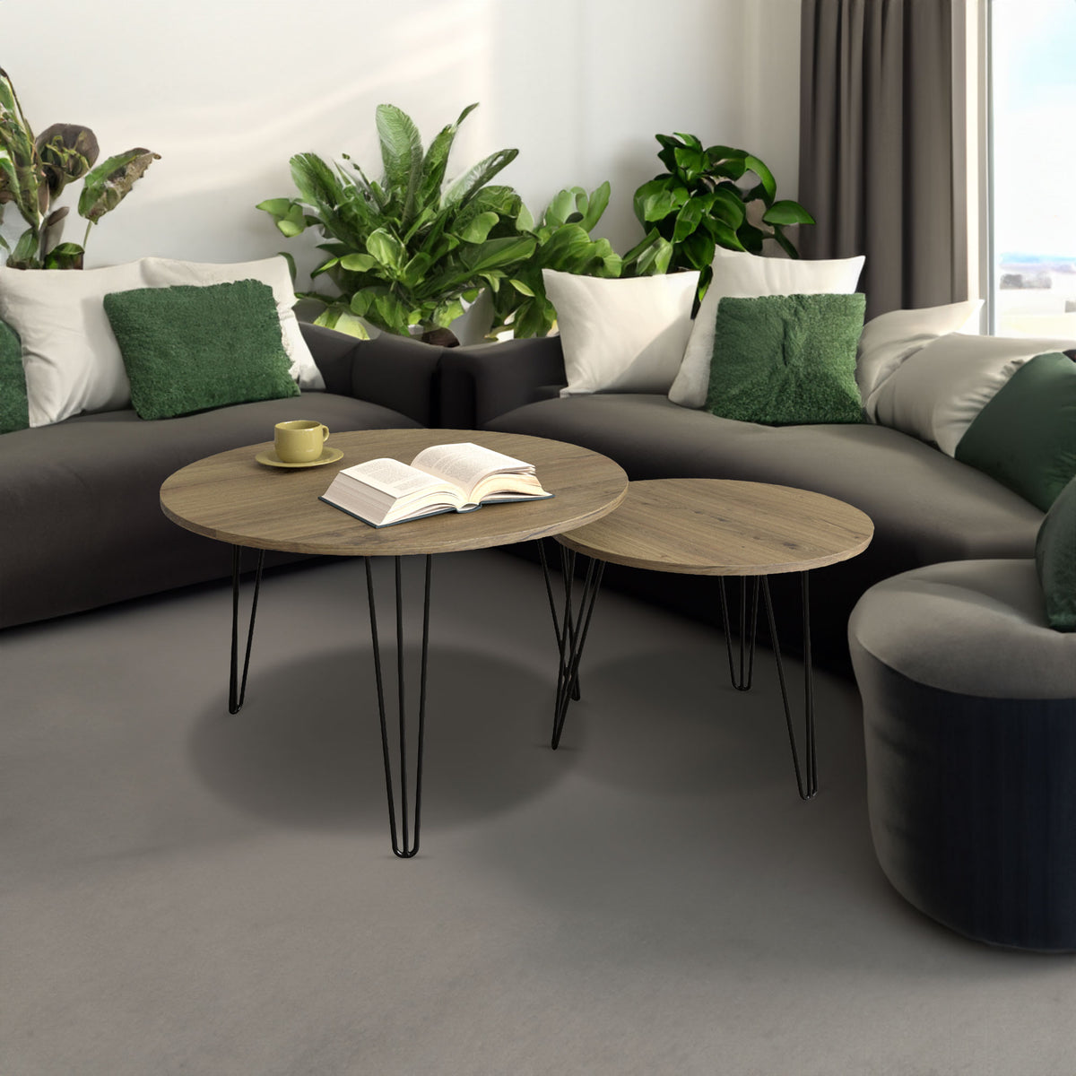 Round nesting coffee table set of 2 with light brown wood tops and black metal legs