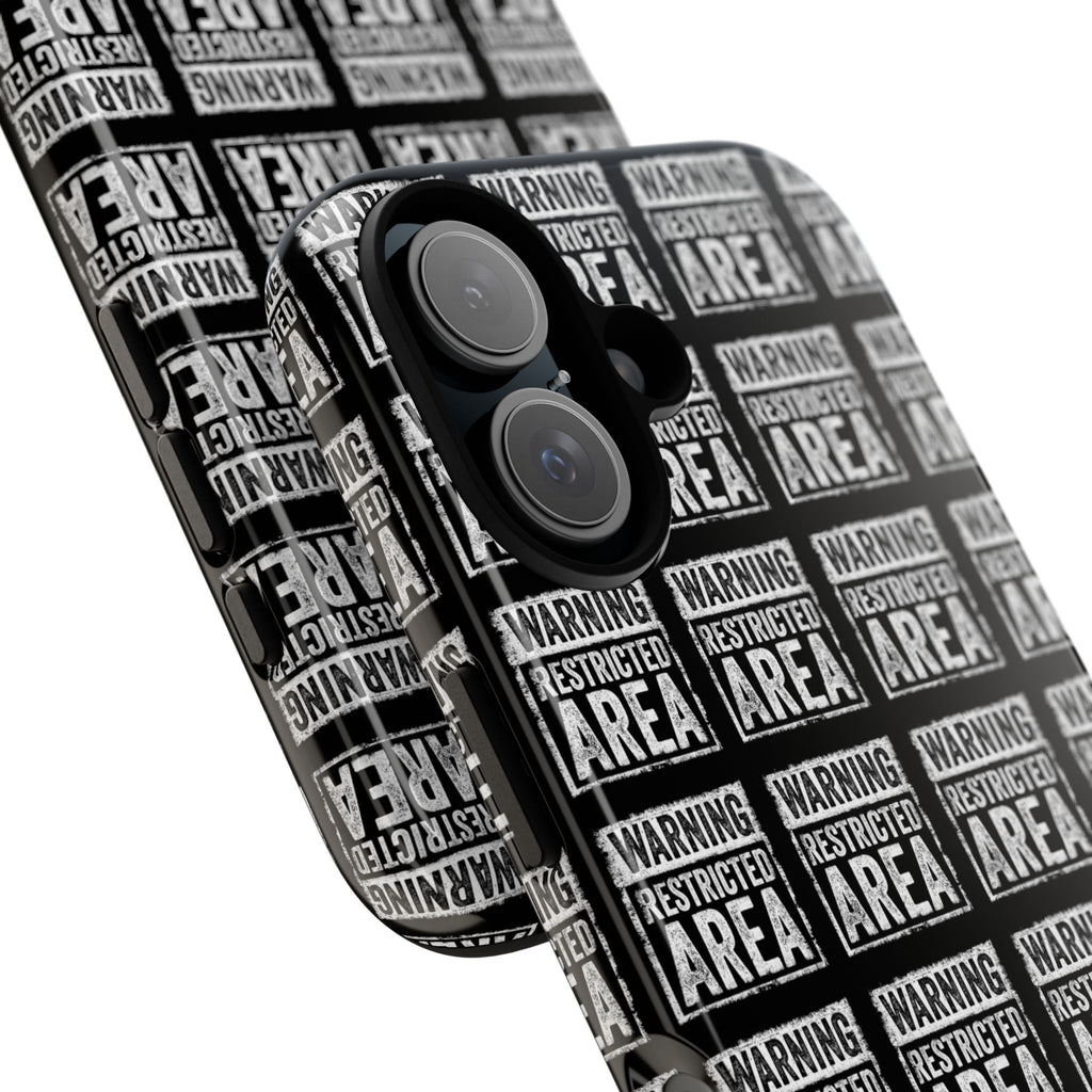 Diagonal close-up of black phone case with white 'RESTRICTED AREA' warning print