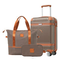 Hardshell carry-on suitcase with copper top handle, matching duffle bag, and front pouch