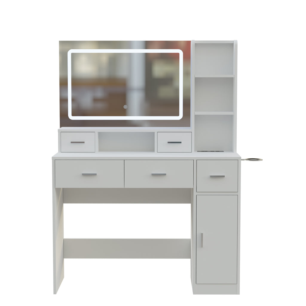White vanity dressing table with framed mirror, drawers, and open storage shelves