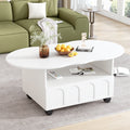White round coffee table with open shelf and drawer, casters; snacks and magazines on top