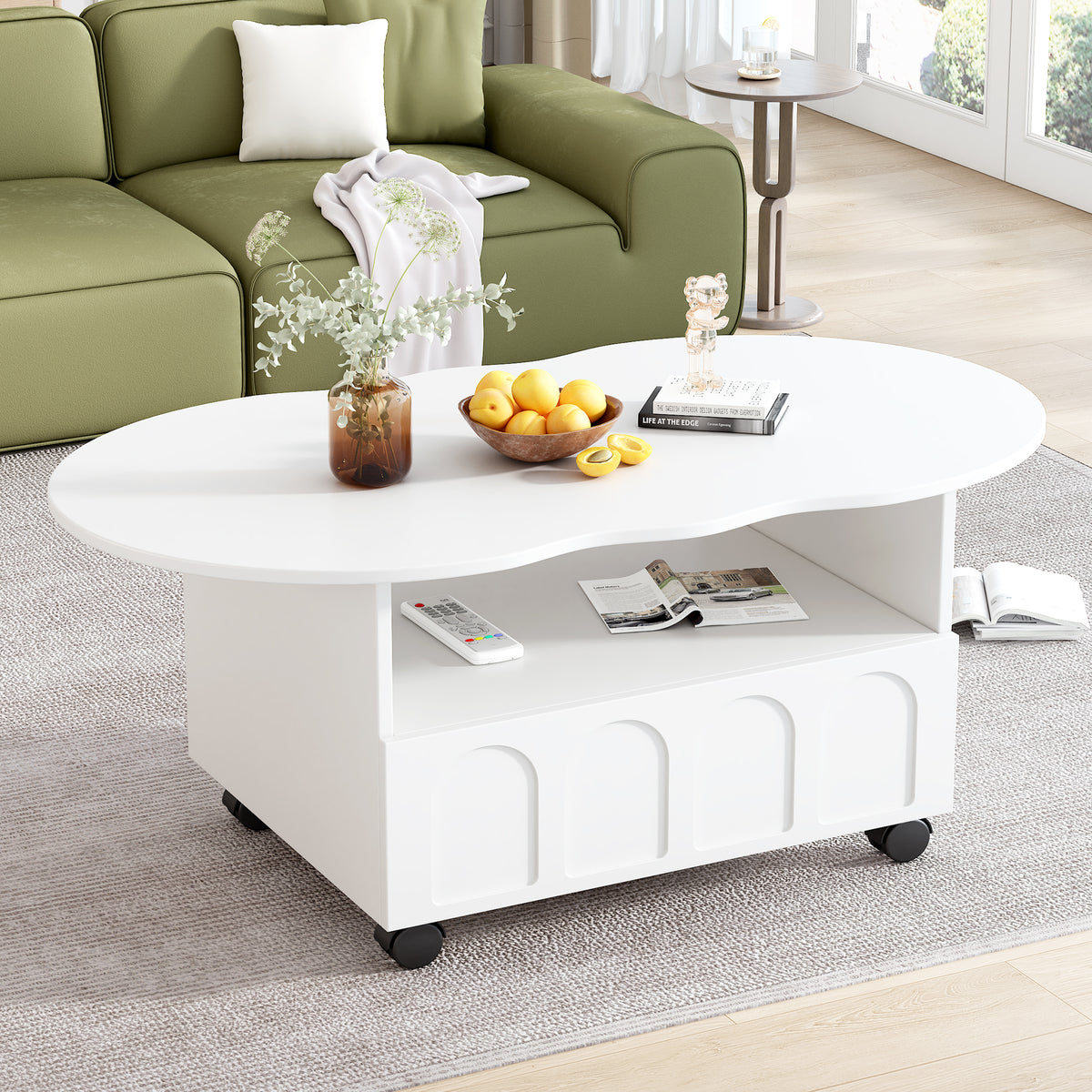 White round coffee table with open shelf and drawer, casters; snacks and magazines on top