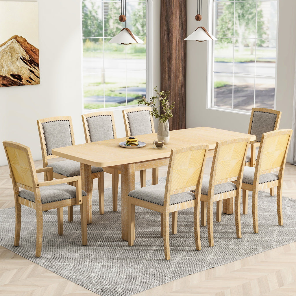 Natural wood dining table set with upholstered chairs and light fabric seats
