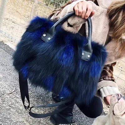 Royal blue faux fur tote with black leather handles and silver snap hardware