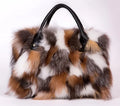 Multicolored faux fur handbag with black leather handles and small front snap