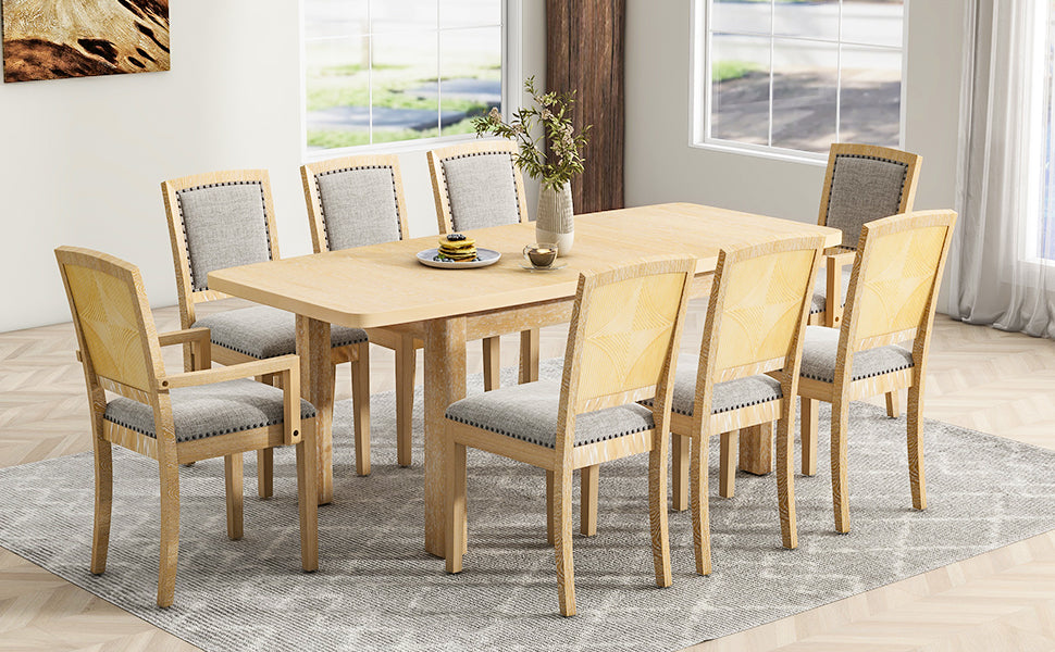 Wood dining table with upholstered chairs featuring padded seats and backrests