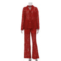 Red lace sheer two-piece shirt and wide-leg pants set on mannequin, front view.